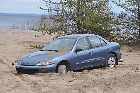 dodge neon embedded in sand dune tadoussac saguenay river st lawrence quebec canada mai may 2012