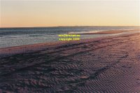 southernmost point of Long Beach island New Jersey looking south to Atlantic City sunset copyright free photo royalty free photo